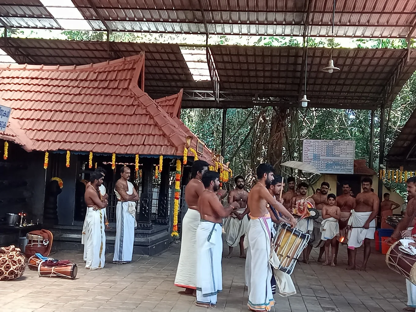 Devotees performing Noorum Palum at Vetticode Nagaraja Temple