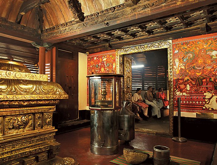 Devotees performing rituals at Thiruvairanikulam Mahadeva Temple during festival celebrations