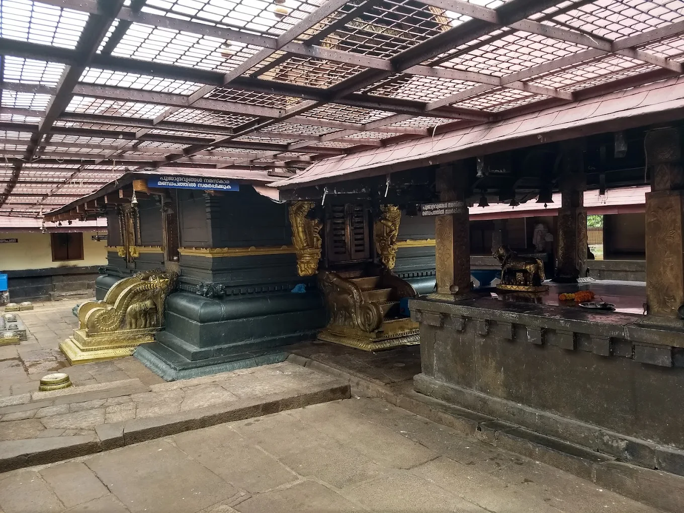 Devotees performing pooja at Sasthamcotta Sree Dharma Sastha Temple