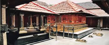 Entrance of Sree Krishna Temple with carved wooden doors and pillars