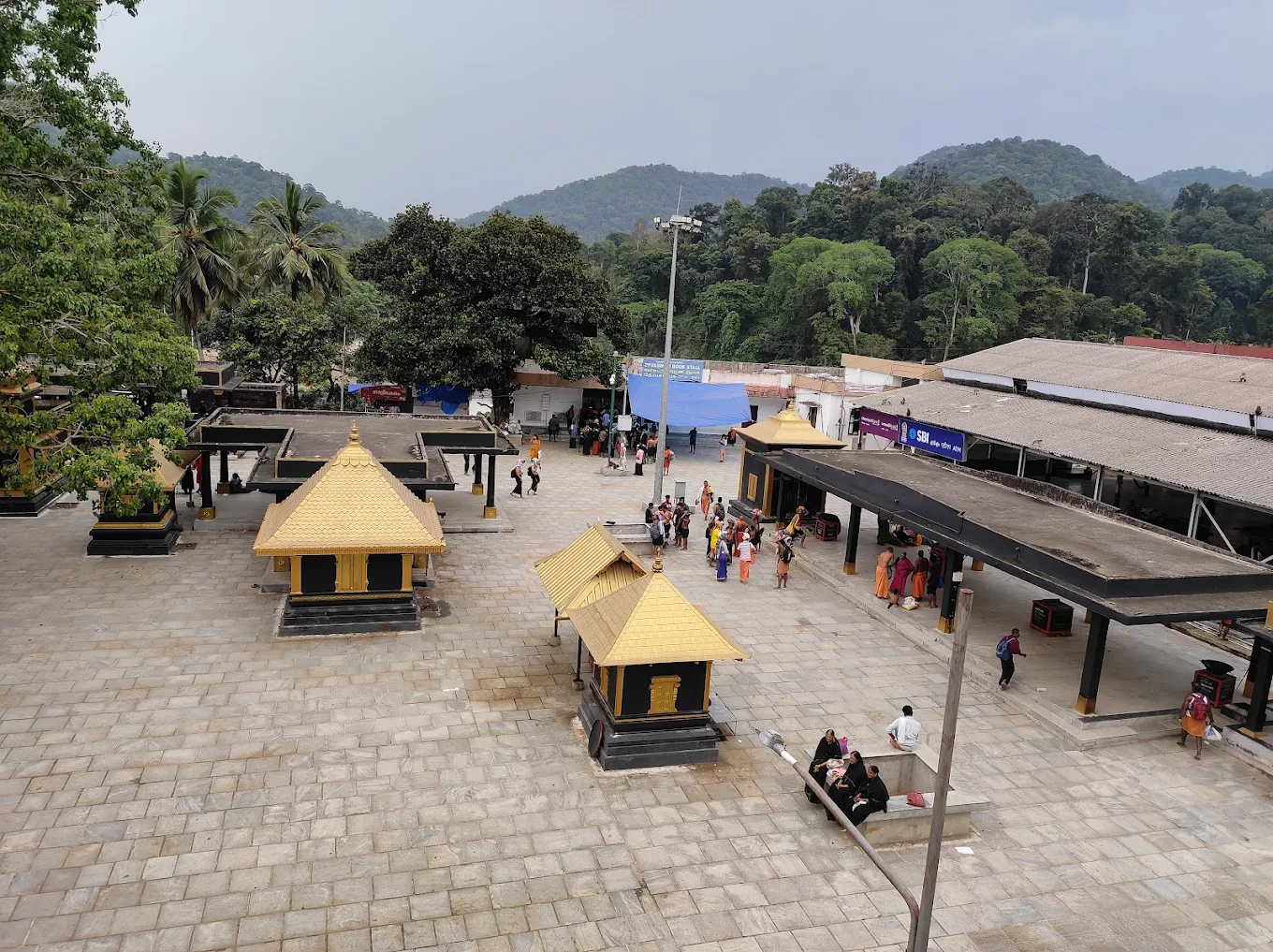 Devotees breaking coconuts at Pampa Ganapati Kovil before Sannidhanam climb 