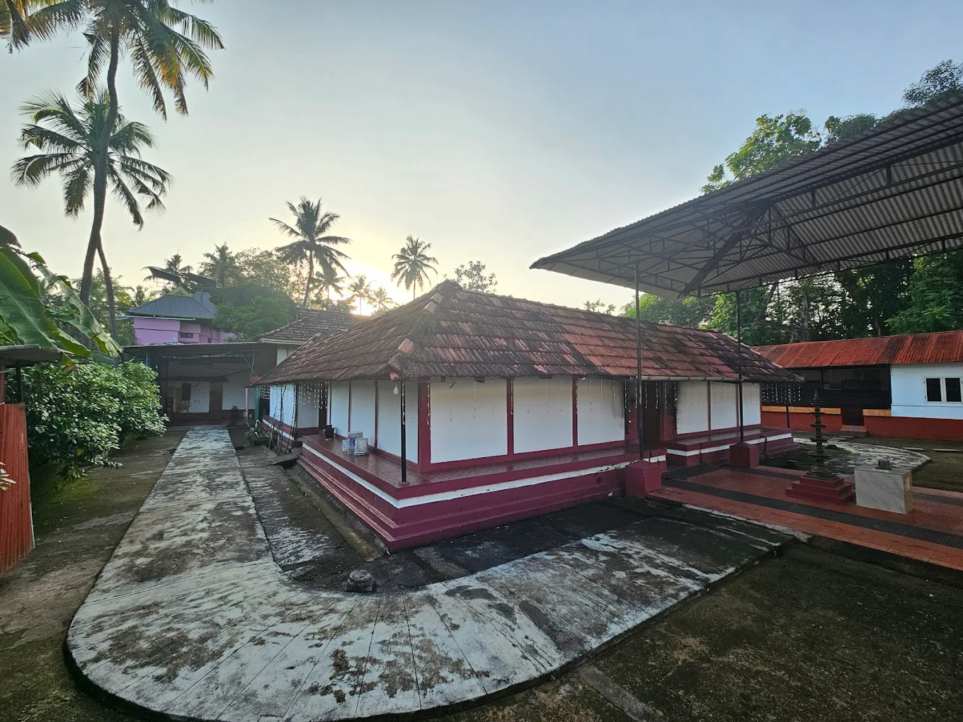 Temple entrance with hanging lamps at Mithranandapuram Temple