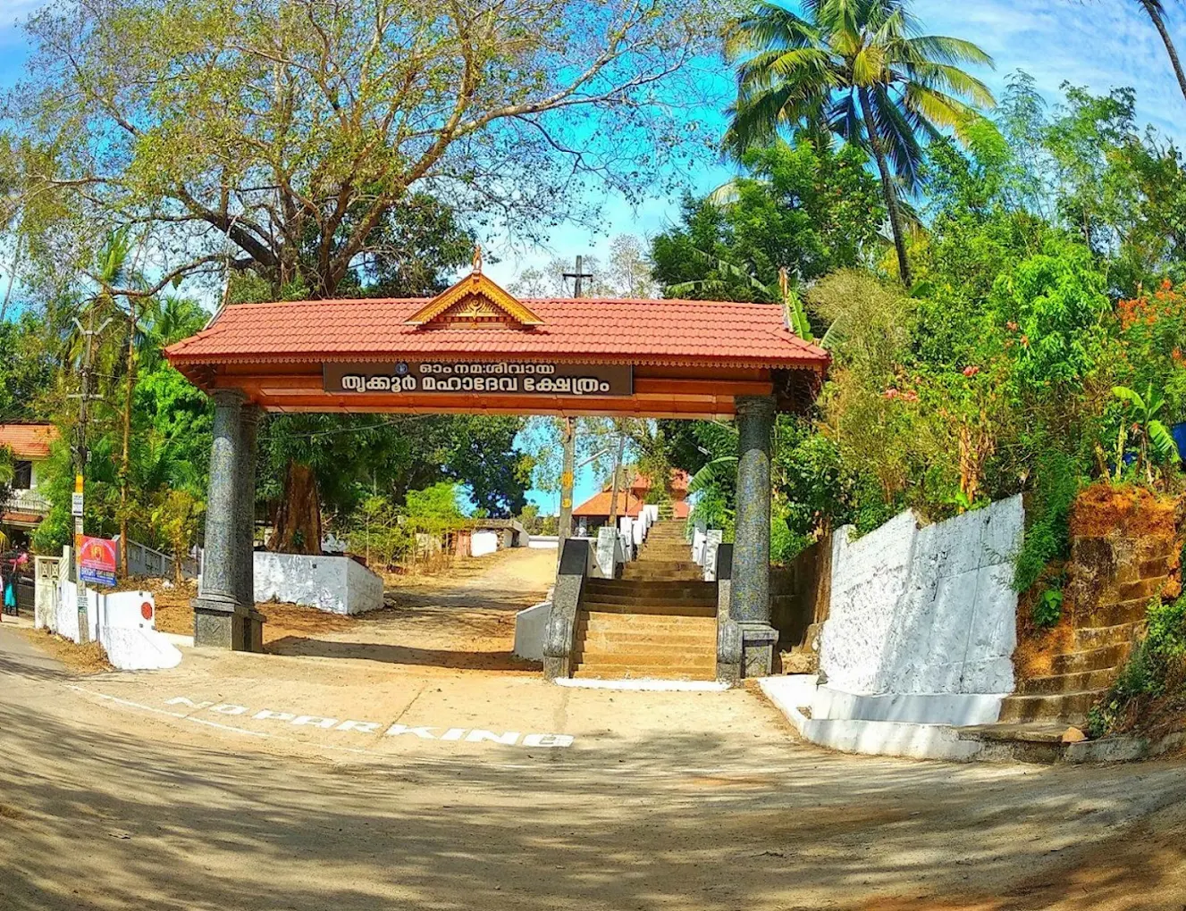raditional oil lamps lighting the cave interior of Thrikkur Mahadeva Temple