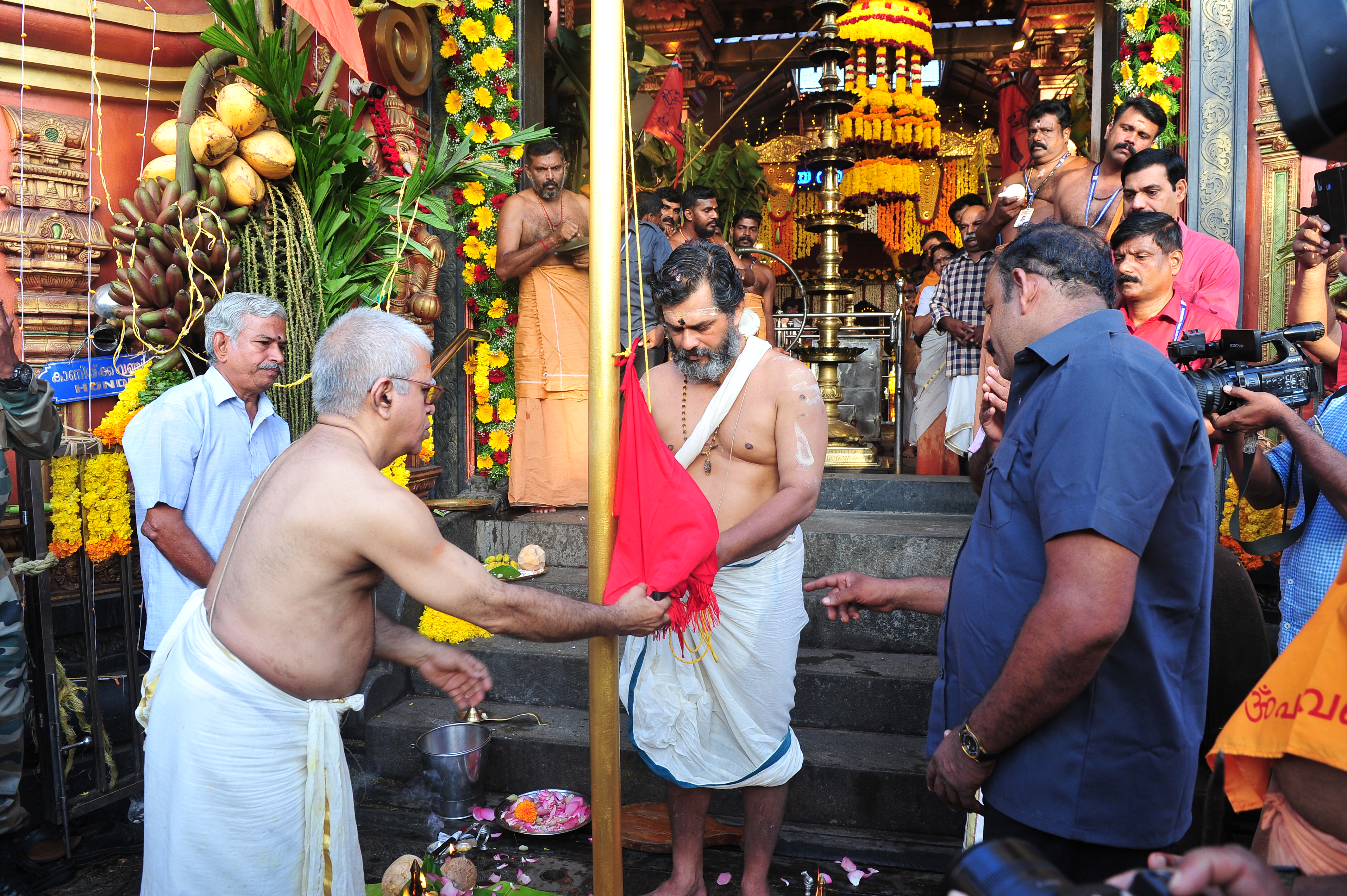 Devotees offering coconuts at Pazhavangadi Ganapathy Temple Kerala