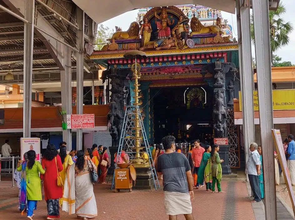 Entrance of Attukal Bhagavathy Temple adorned with lamps and floral decorations