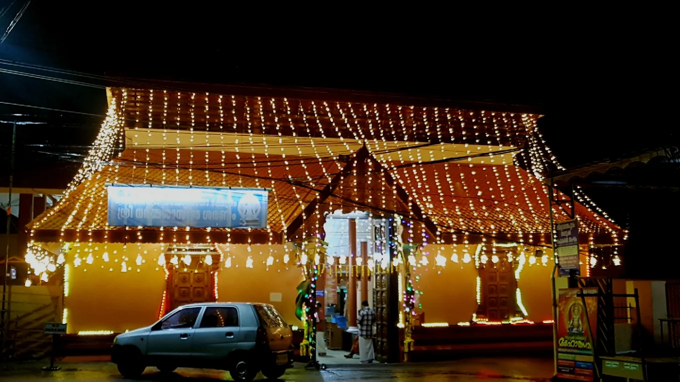 Entrance of Thycaud Sri Dharma Sastha Temple adorned with lamps and floral decorations