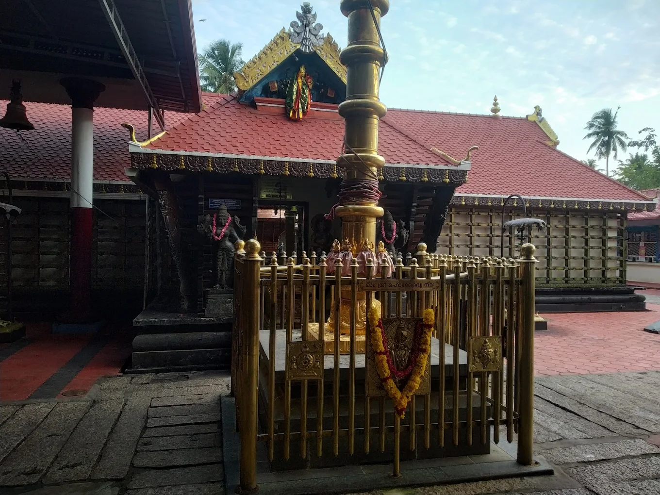 Entrance of Sree Udiyanoor Devi Temple adorned with lamps and floral decorations